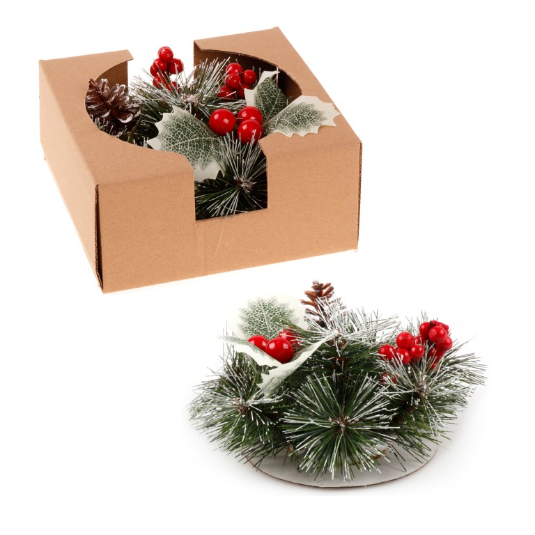 Festive pine and berry wreath in cardboard box.
