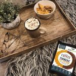 instant coffee with 95% pure organic curcumin turmeric extract powder (1,000mg) 120g Tray with coffee, snacks, glasses, plant.