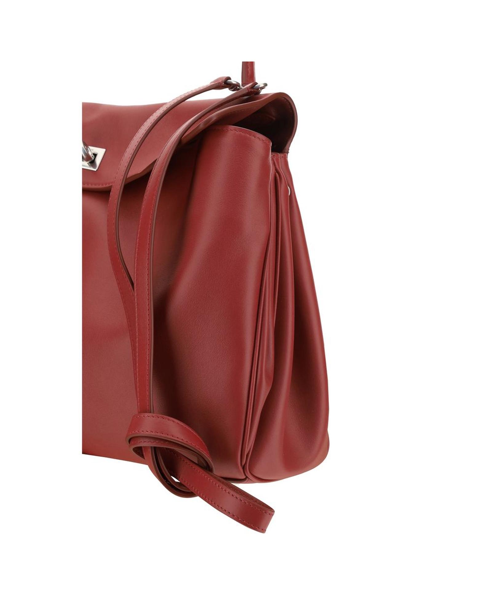 Red leather handbag with strap detail.