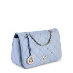 Light blue quilted handbag with chain strap.