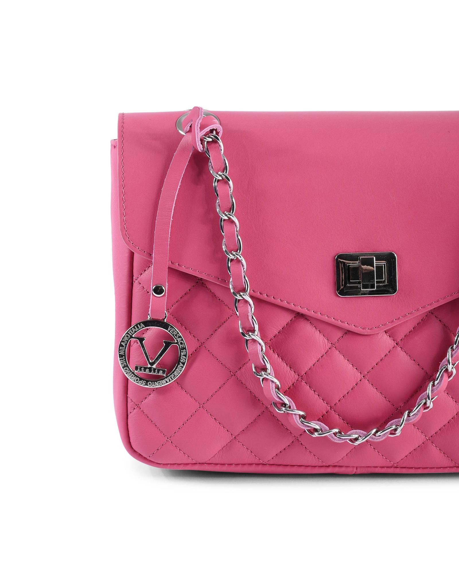 Pink quilted handbag with chain strap.