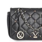 Black quilted handbag with gold accents and chain.