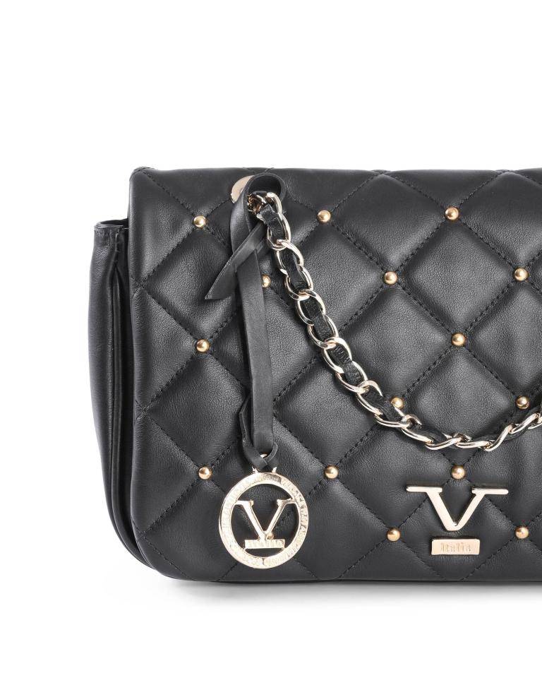Black quilted handbag with gold accents and chain.