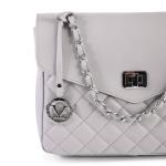 Grey quilted handbag with silver chain strap.
