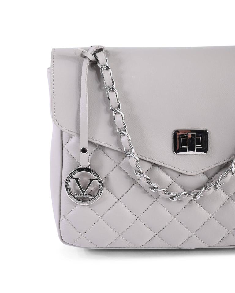Grey quilted handbag with silver chain strap.