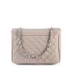 Beige quilted handbag with chain strap.