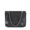 v539 btb109406 202506160312 00.jpg Black quilted handbag with chain strap detail.