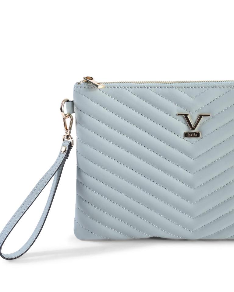 Light blue quilted wristlet handbag with chevron pattern.