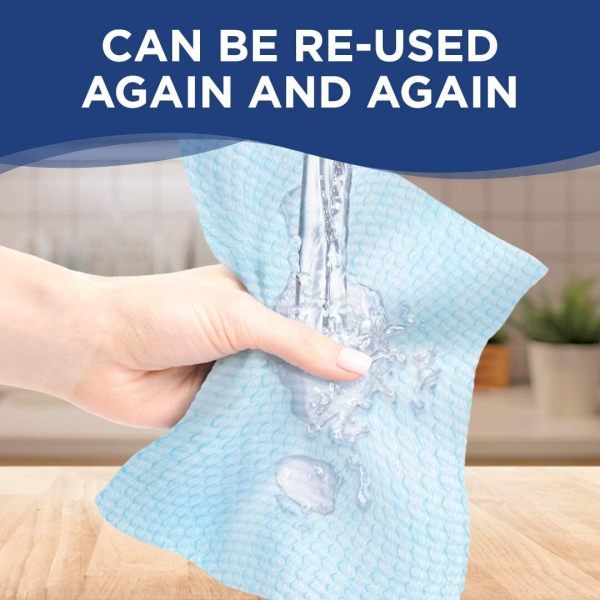 Reusable blue cleaning cloth under running water.