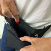 pierre cardin inspired milleni luggage bag large in blue + free milleni waist bag Person opening black zippered pouch with red nails.
