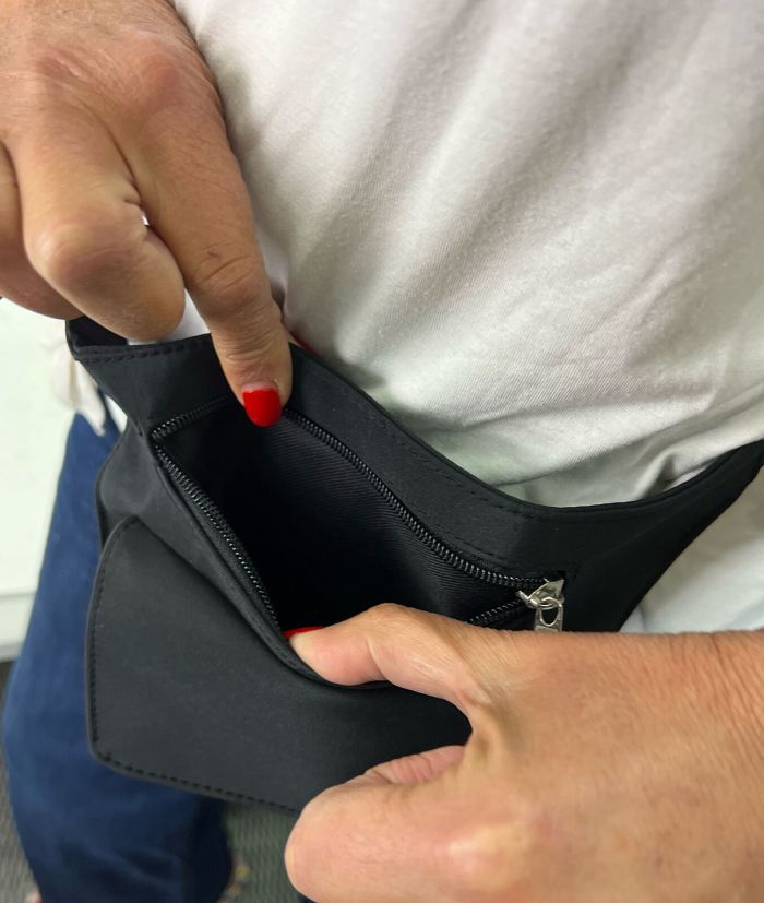 pierre cardin inspired milleni luggage bag large in blue + free milleni waist bag Person opening black zippered pouch with red nails.