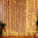 Fairy lights on curtain create warm, cosy ambiance.