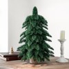 Artificial Christmas tree on wooden table