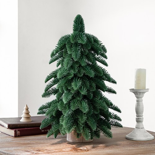 v888 elosung10511 205490 00.jpg Artificial Christmas tree on wooden table