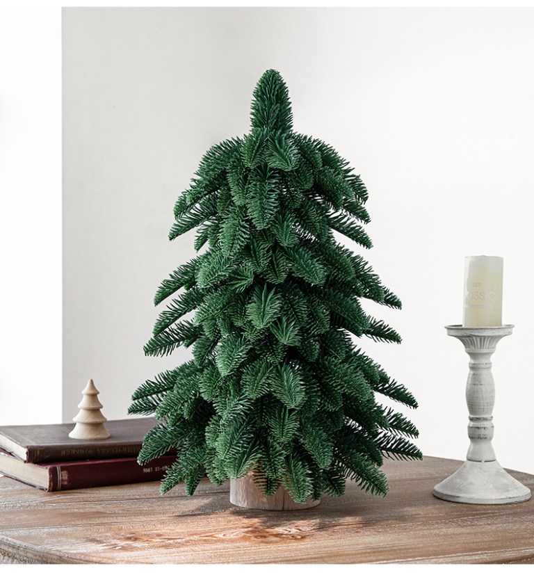 v888 elosung10511 205490 00.jpg Artificial Christmas tree on wooden table