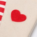 Red heart on beige linen fabric