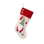 Christmas stocking with gnome and decorations.