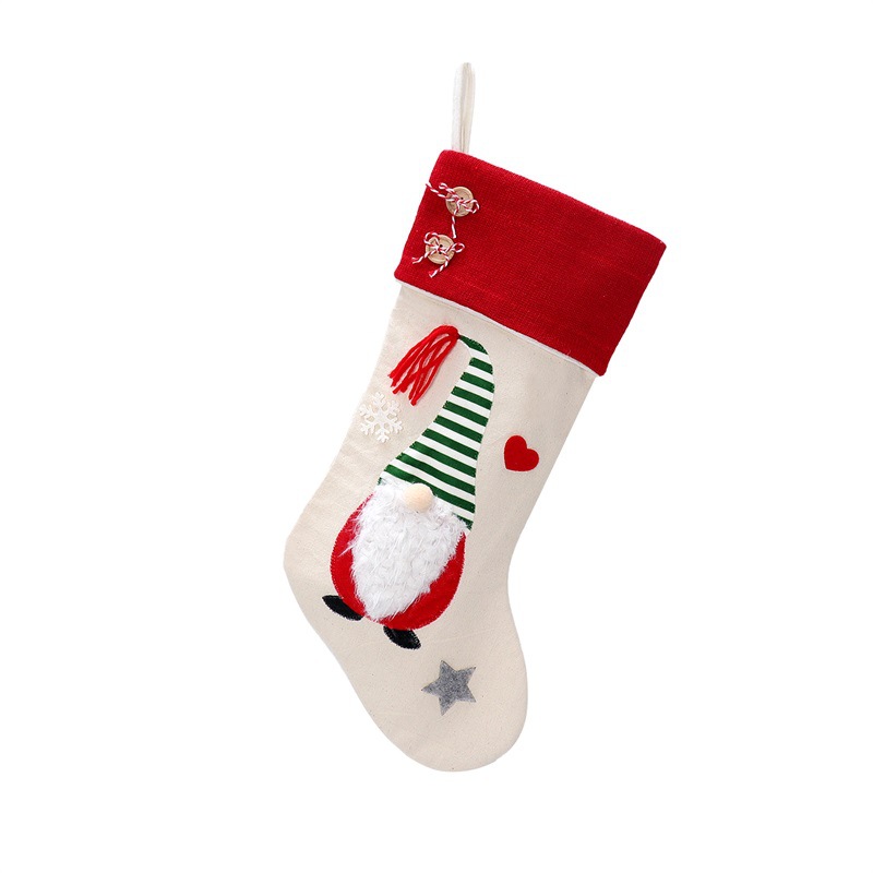 Christmas stocking with gnome and decorations.