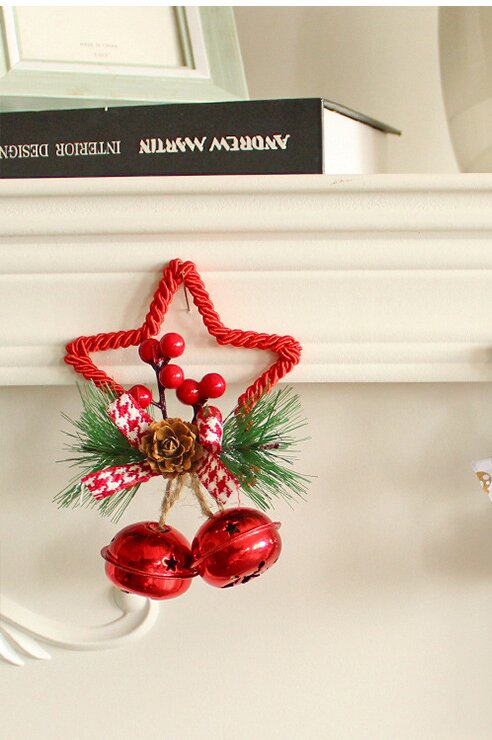 Christmas star decoration with bells and pinecones.