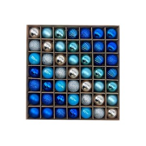 Box of assorted blue Christmas baubles.