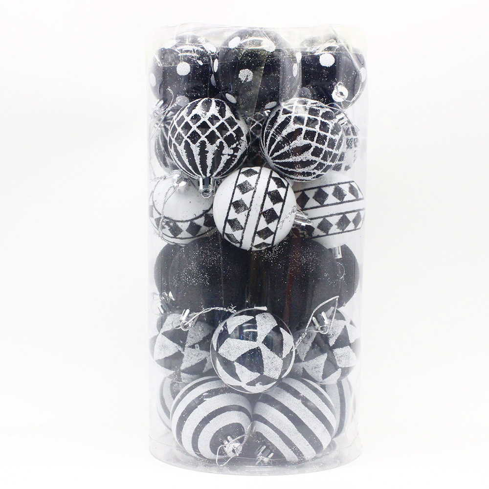 v888 elosung33190 202506061711 00.jpg Black and white Christmas baubles in a clear container.