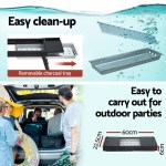 Portable BBQ with removable charcoal tray, easy cleanup.