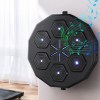 Electronic wall drum with glowing pads and music notes.
