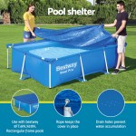 Two people covering a Bestway Steel Pro pool.