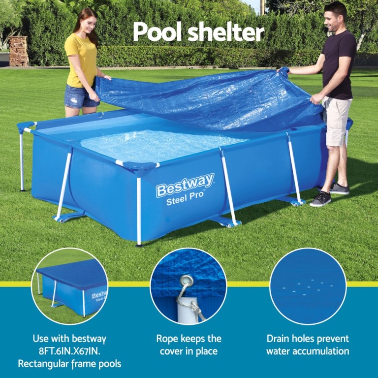 Two people covering a Bestway Steel Pro pool.