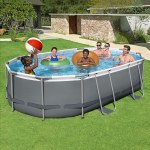 bestway 488x305x107cm swimming pool steel frame set w/ pump filter ladder cover Group playing in above-ground pool with inflatable rings.