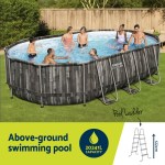 bestway swimming pool steel frame pool set 6.1x3.66m w/ filter pump ladder cover People enjoying an above-ground swimming pool, 20241L capacity.