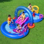 bestway kids inflatable play splash pool with slide ball tossing toys coral basket Kids playing in inflatable water park on grass.