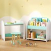 Children's playroom with books, table, and toys.