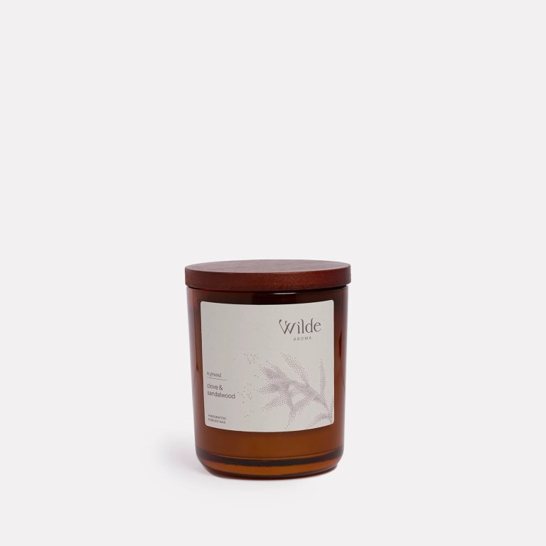 Wilde Aroma clove sandalwood candle with wooden lid.