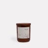 Amber candle with wooden lid, labelled honeysuckle bushflower.
