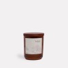 Brown candle with oakmoss and orange scent.