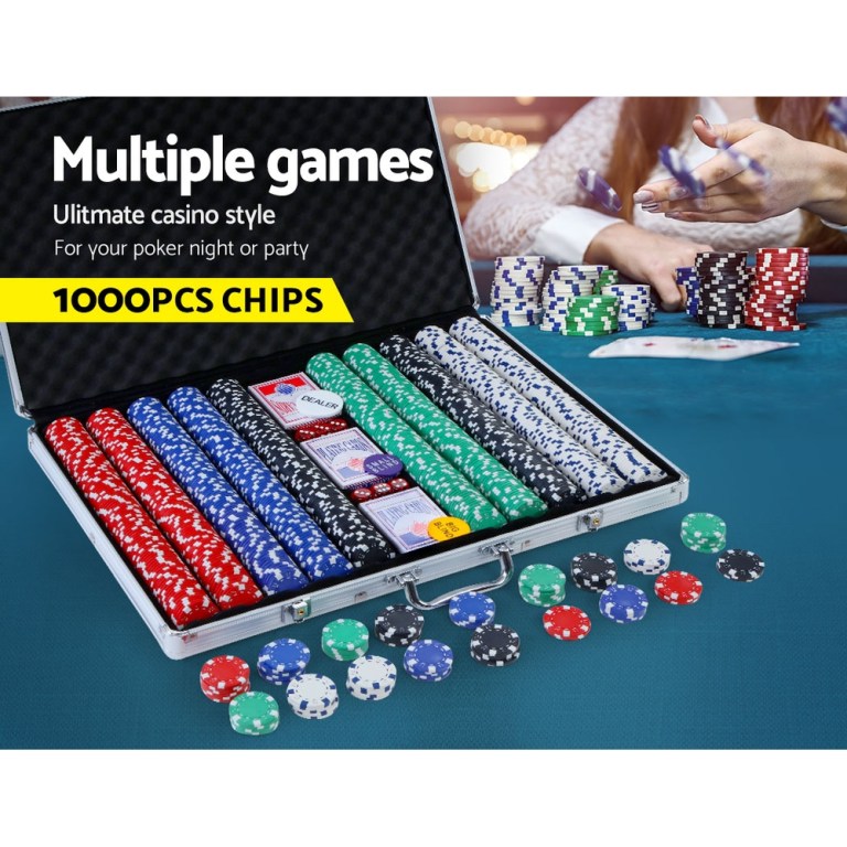 Poker chips set with cards and case on table.
