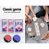 Classic playing cards on table with drinks.
