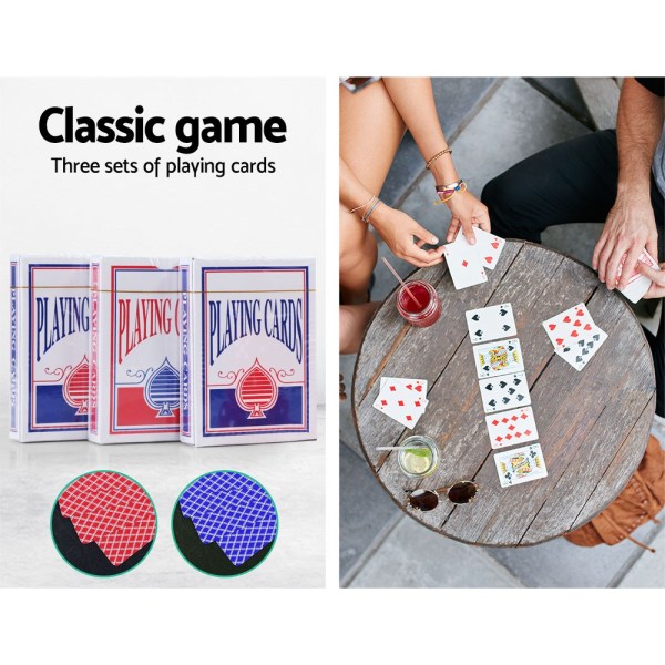 Classic playing cards on table with drinks.