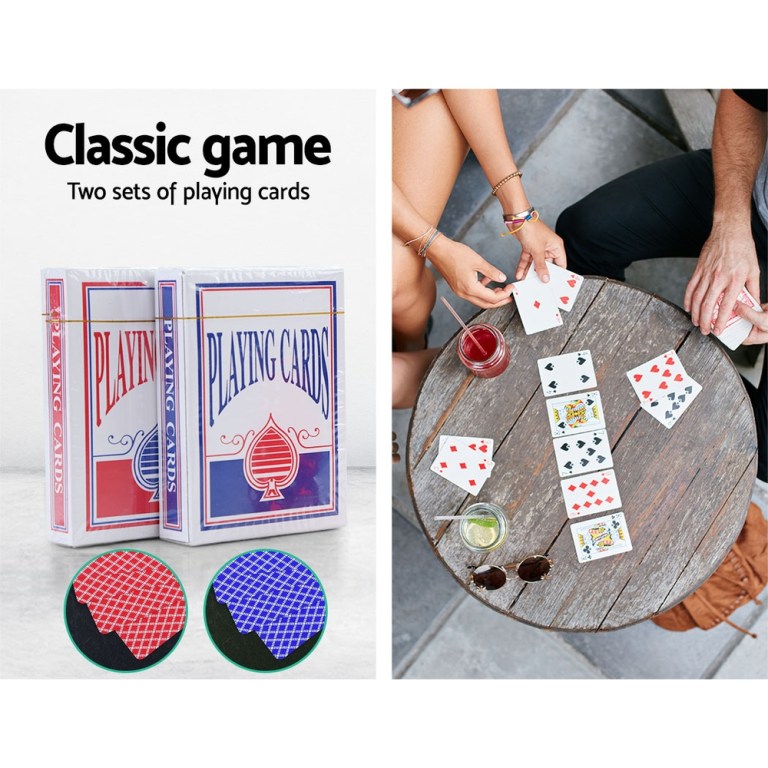 Two sets of classic playing cards on table.