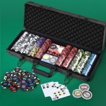 Poker chip set with cards and dice on table.