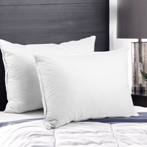 pillow dfd x2 202502281434 00.jpg Two white pillows on modern bed with lamp.