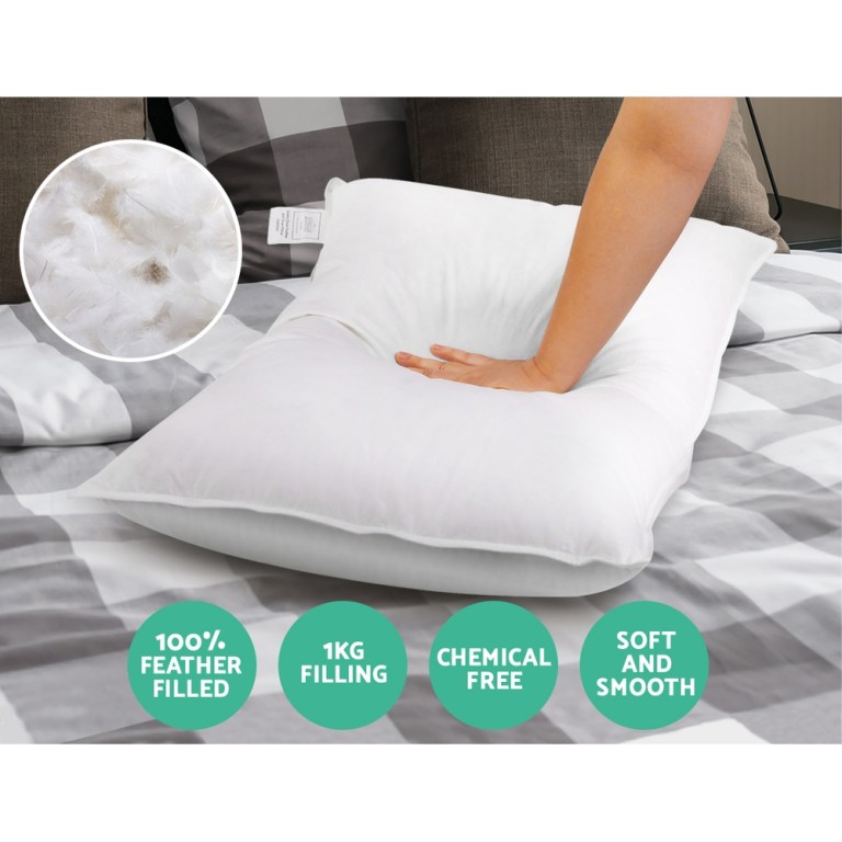 giselle bedding duck feather down pillow twin pack Soft, feather-filled pillow with hand pressing down.