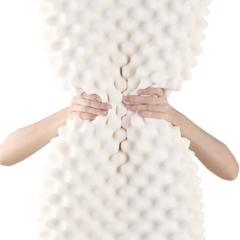giselle bedding natural latex pillow twin pack Hands squeezing textured white foam mattress