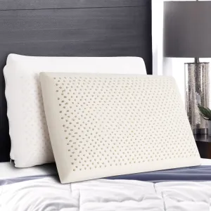 Two latex pillows on a bed