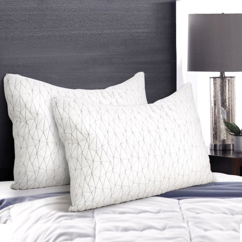 pillow mefo rayon s 202502281438 00.jpg White pillows on a modern bed with lamp.