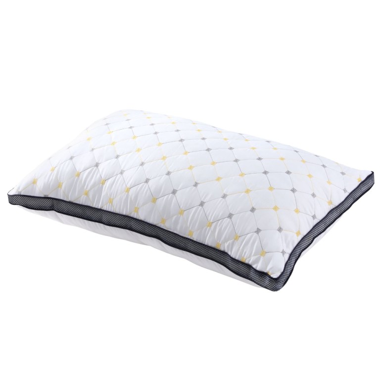 White pillow with quilted design