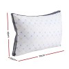 White rectangular pillow with dimensions 45x70x25cm.