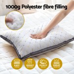 Hand pressing soft polyester fibre pillow.