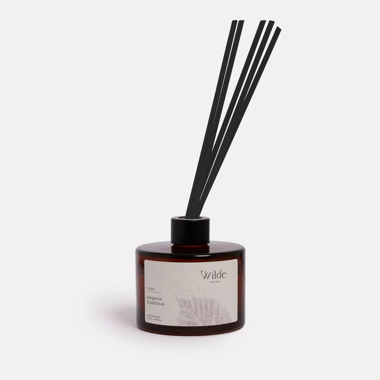 reed diffuser clove & sandalwood by wilde aroma (copy) Bergamot and patchouli diffuser in brown bottle.